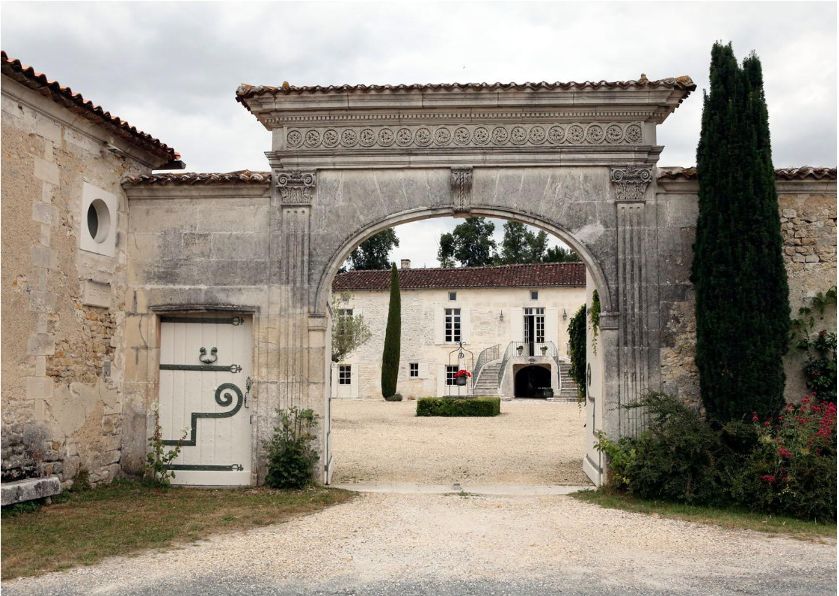 In the Cognac region, the monumental basket-handle entrance porch often has a beautiful frieze carved in the ashlar. The concern for decoration contrasts with the tiled mansion.